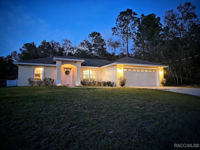 view of front facade featuring a front yard and a garage