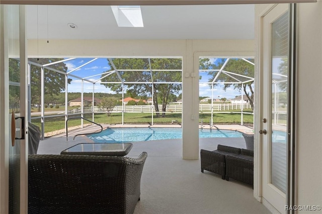 outdoor pool featuring fence, a patio, and a lanai
