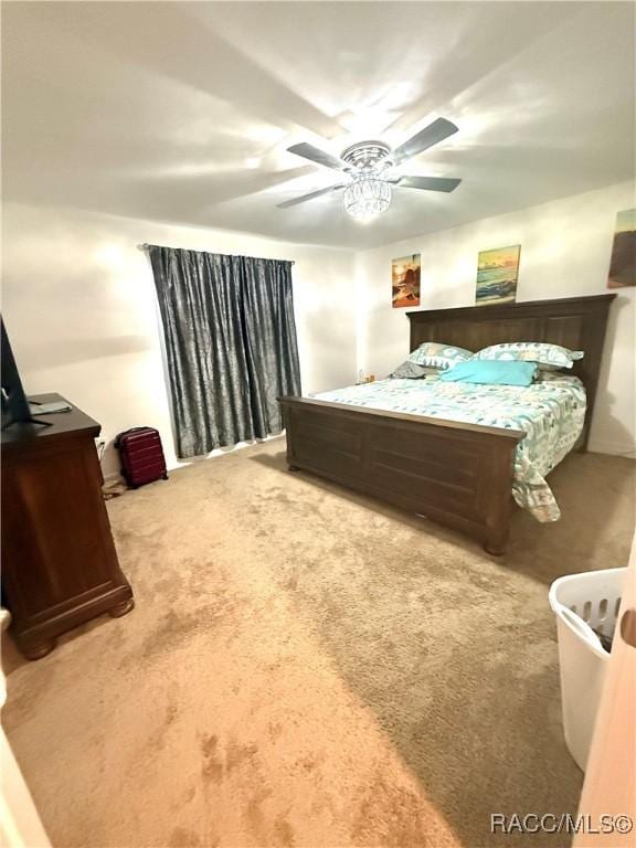 bedroom with ceiling fan and carpet floors