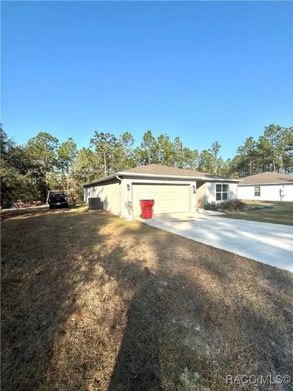 exterior space featuring a garage and central AC unit