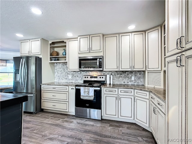 kitchen featuring open shelves, recessed lighting, backsplash, appliances with stainless steel finishes, and wood finished floors