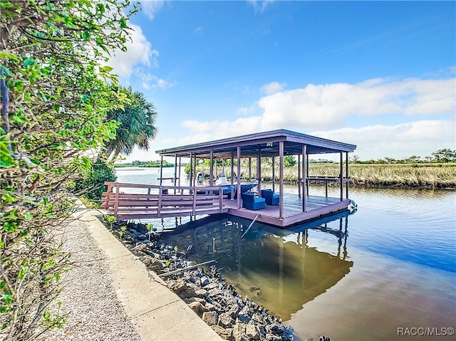 dock area featuring a water view and boat lift