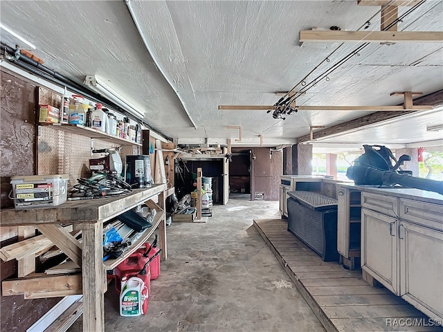 misc room featuring a workshop area and concrete flooring