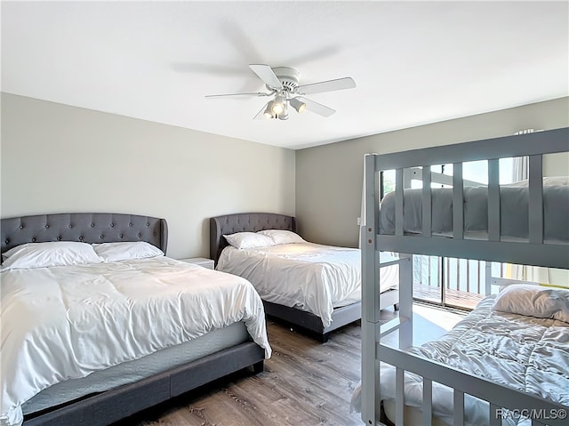 bedroom featuring wood finished floors and a ceiling fan