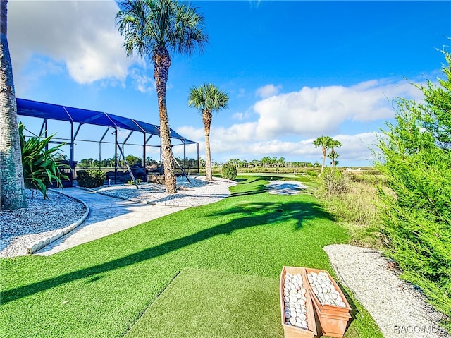 view of yard featuring glass enclosure