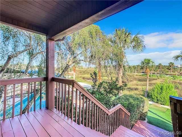 wooden terrace featuring an outdoor pool