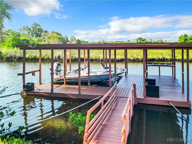 dock area featuring a water view