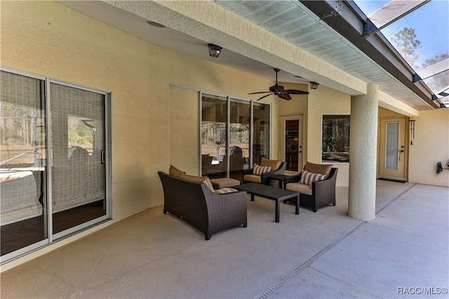 view of patio / terrace with a lanai and ceiling fan