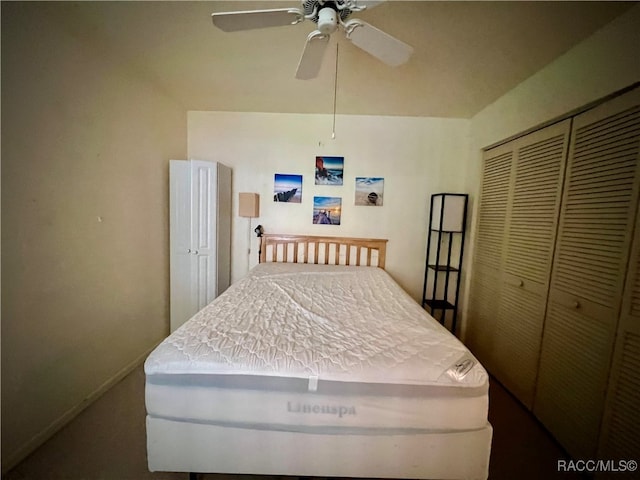 bedroom with ceiling fan and a closet