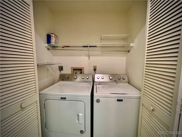 washroom with washing machine and dryer