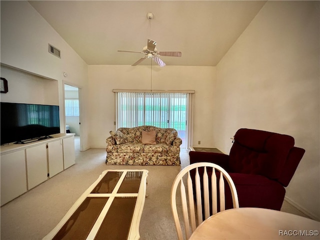 carpeted living room featuring a wealth of natural light, ceiling fan, and high vaulted ceiling