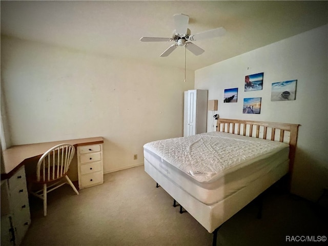 bedroom with ceiling fan and carpet