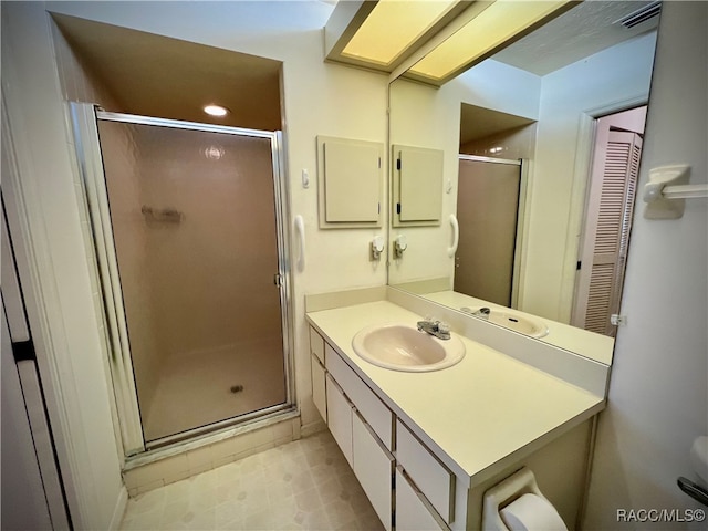 bathroom with vanity and an enclosed shower