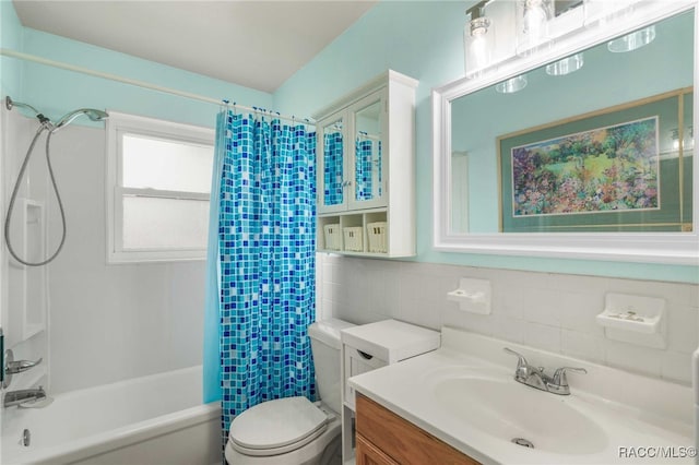 53 S Columbus St, Beverly Hills, FL 34465 - bathroom featuring tile walls, vanity, and shower / bath combination with curtain