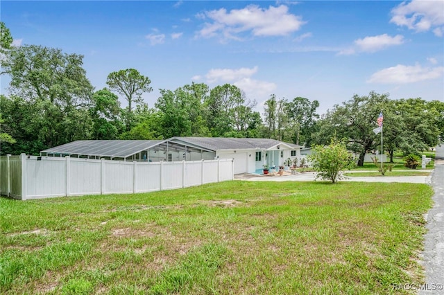 53 S Columbus St, Beverly Hills, FL 34465 - view of yard featuring a garage, concrete driveway, and view of scattered trees