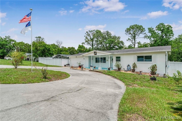 53 S Columbus St, Beverly Hills, FL 34465 - ranch-style house featuring curved driveway, stucco siding, and an attached garage
