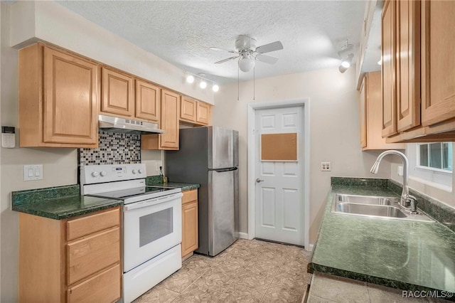 53 S Columbus St, Beverly Hills, FL 34465 - kitchen featuring electric stove, under cabinet range hood, ceiling fan, freestanding refrigerator, and a textured ceiling