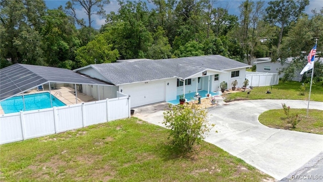 53 S Columbus St, Beverly Hills, FL 34465 - view of front of home with driveway, an attached garage, and roof with shingles
