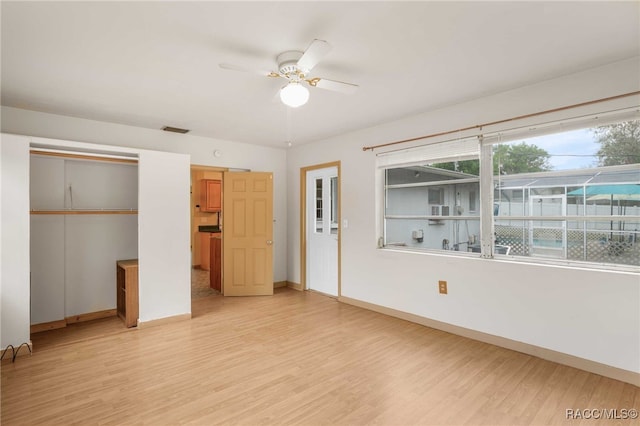 53 S Columbus St, Beverly Hills, FL 34465 - unfurnished bedroom featuring light wood-style flooring, a ceiling fan, and a closet