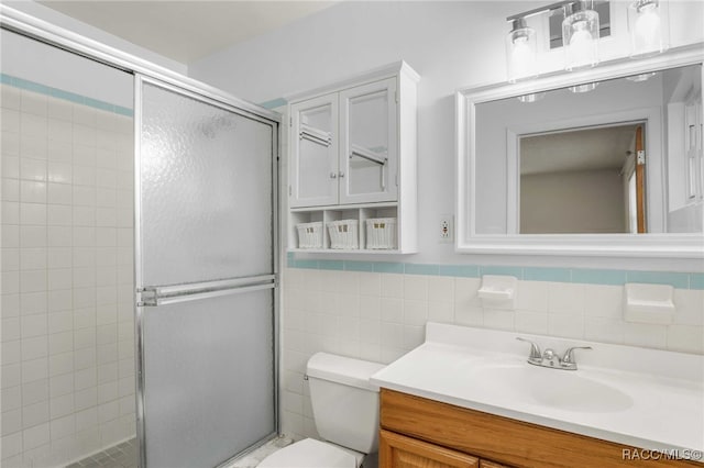 53 S Columbus St, Beverly Hills, FL 34465 - full bathroom featuring vanity, a stall shower, and tile walls