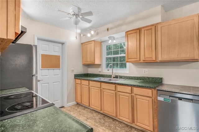 53 S Columbus St, Beverly Hills, FL 34465 - kitchen with stainless steel appliances, a ceiling fan, dark countertops, a textured ceiling, and light brown cabinets