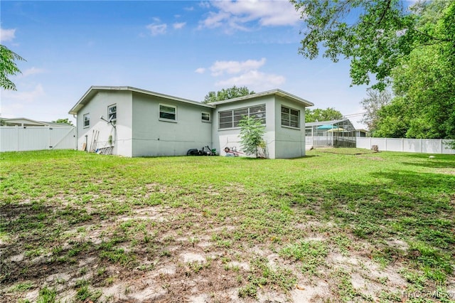 53 S Columbus St, Beverly Hills, FL 34465 - rear view of property featuring a fenced backyard