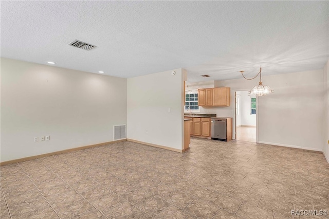 53 S Columbus St, Beverly Hills, FL 34465 - unfurnished living room with a chandelier, a textured ceiling, and recessed lighting