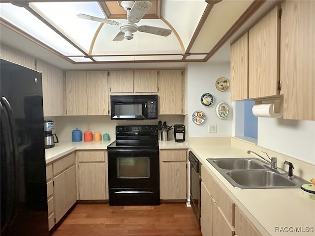 kitchen featuring light brown cabinetry, ceiling fan, sink, black appliances, and dark hardwood / wood-style floors