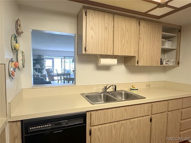 kitchen with dishwasher, light brown cabinets, and sink