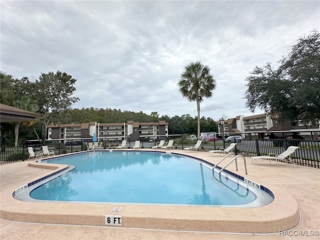 view of swimming pool with a patio