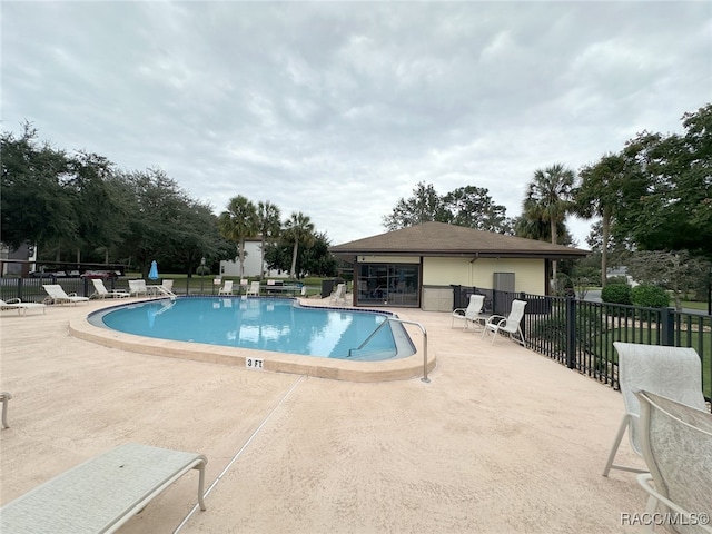 view of pool featuring a patio area