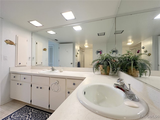 bathroom featuring vanity and an enclosed shower