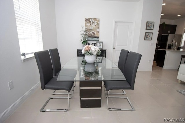 tiled dining area with a wealth of natural light