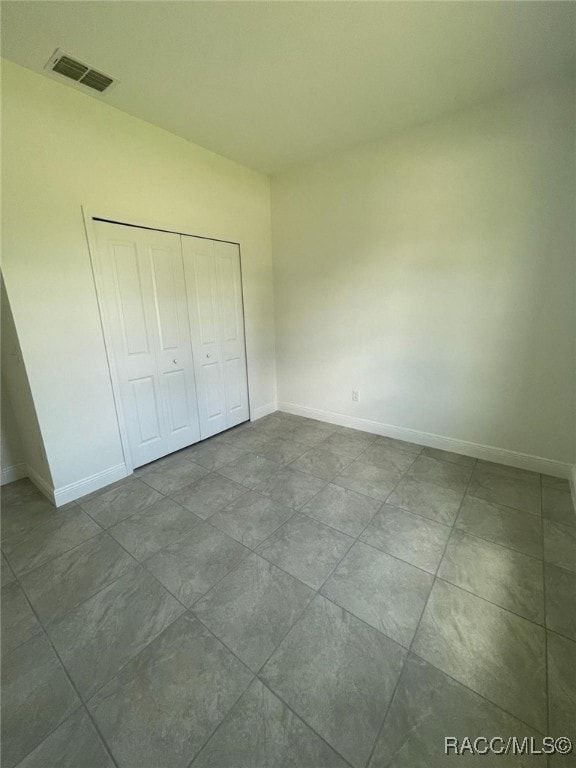 unfurnished bedroom featuring a closet