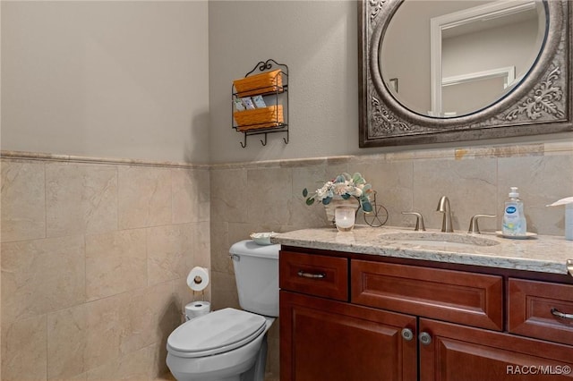 1576 N Eagle Ridge Path, Hernando, FL 34442 - bathroom with vanity, tile walls, and a wainscoted wall
