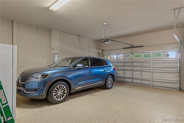 1576 N Eagle Ridge Path, Hernando, FL 34442 - garage with freestanding refrigerator, a garage door opener, and electric panel