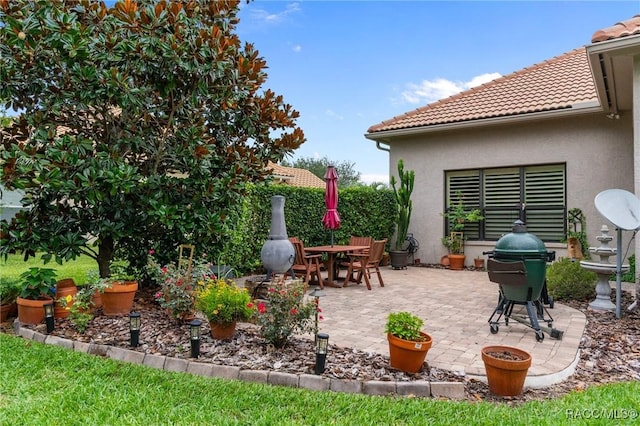 1576 N Eagle Ridge Path, Hernando, FL 34442 - view of patio with a grill and outdoor dining area