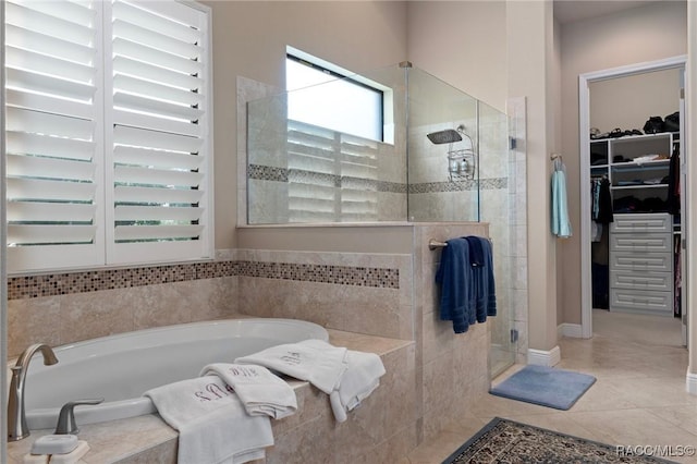 1576 N Eagle Ridge Path, Hernando, FL 34442 - full bath featuring a shower stall, a garden tub, a spacious closet, and tile patterned floors