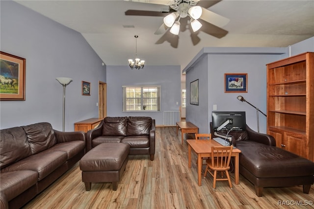 living room featuring lofted ceiling, light wood-type flooring, and ceiling fan with notable chandelier