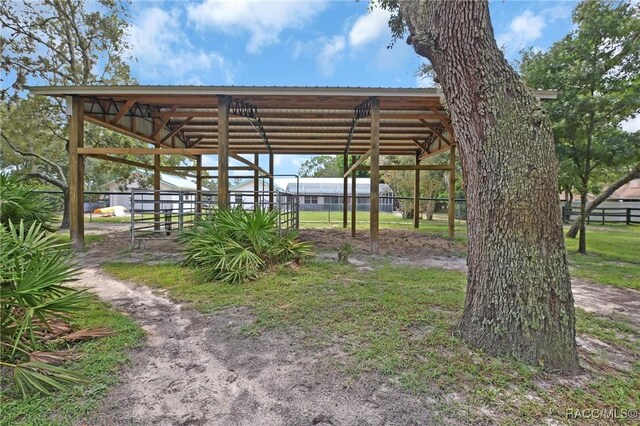 3670 W Cogwood Cir, Beverly Hills, FL 34465 - view of car parking featuring an exterior structure