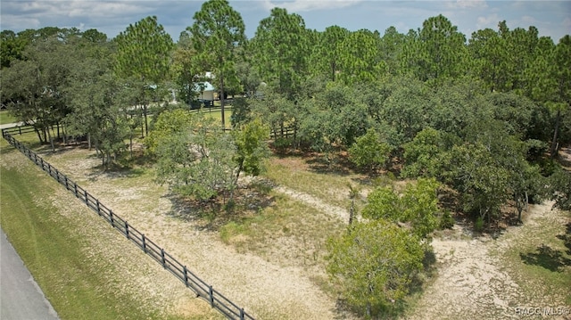 birds eye view of property with a rural view