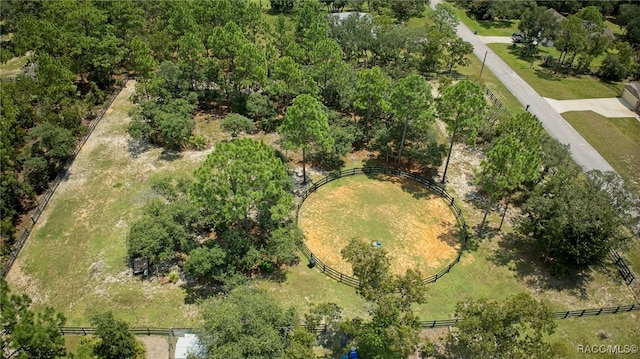 birds eye view of property with a rural view