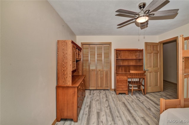 office area featuring a textured ceiling, light hardwood / wood-style floors, and ceiling fan