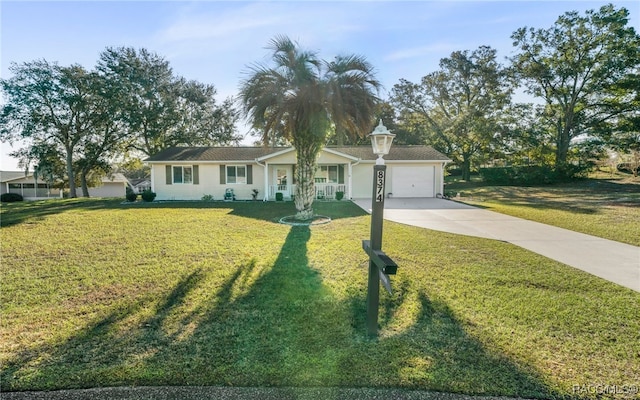 ranch-style home with a front lawn and a garage