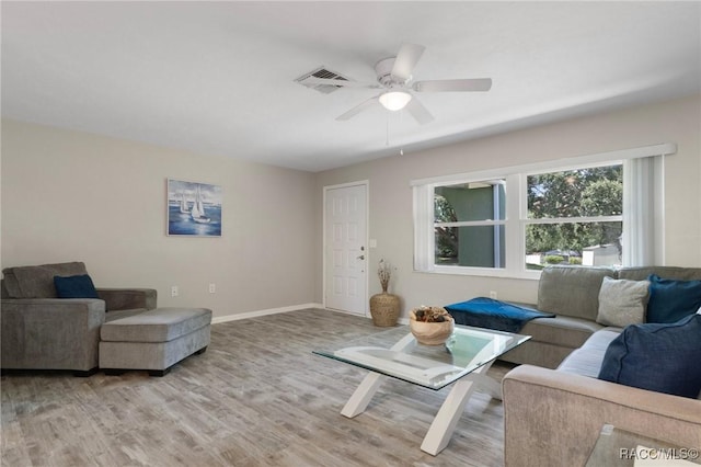 70 W Casurina Pl, Beverly Hills, FL 34465 - living area featuring a ceiling fan, light wood-type flooring, and baseboards