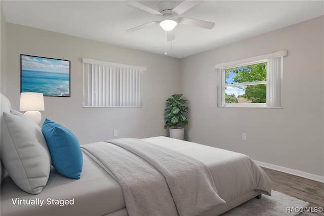70 W Casurina Pl, Beverly Hills, FL 34465 - unfurnished bedroom featuring baseboards, wood finished floors, a closet, and a ceiling fan