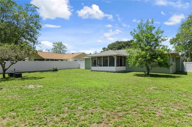 70 W Casurina Pl, Beverly Hills, FL 34465 - back of house with a sunroom