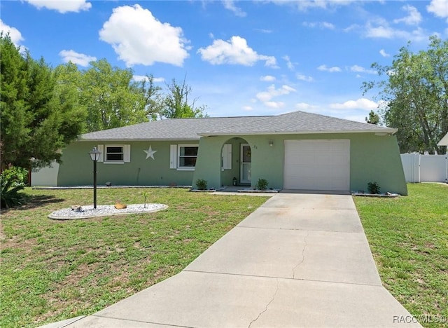 70 W Casurina Pl, Beverly Hills, FL 34465 - ranch-style house featuring stucco siding, an attached garage, and concrete driveway