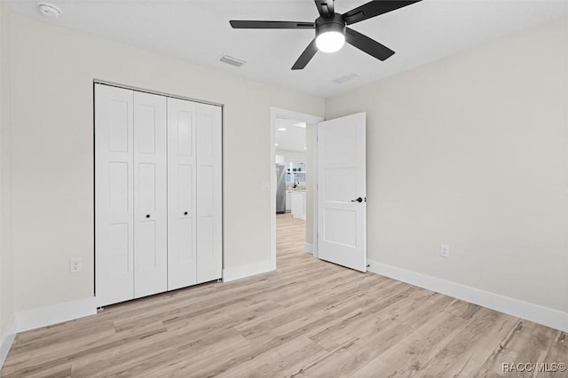 2828 E Celina St, Inverness, FL 34453 - unfurnished bedroom with light wood-type flooring, a closet, and ceiling fan