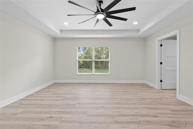 2828 E Celina St, Inverness, FL 34453 - spare room featuring a tray ceiling, light wood-type flooring, recessed lighting, and ceiling fan